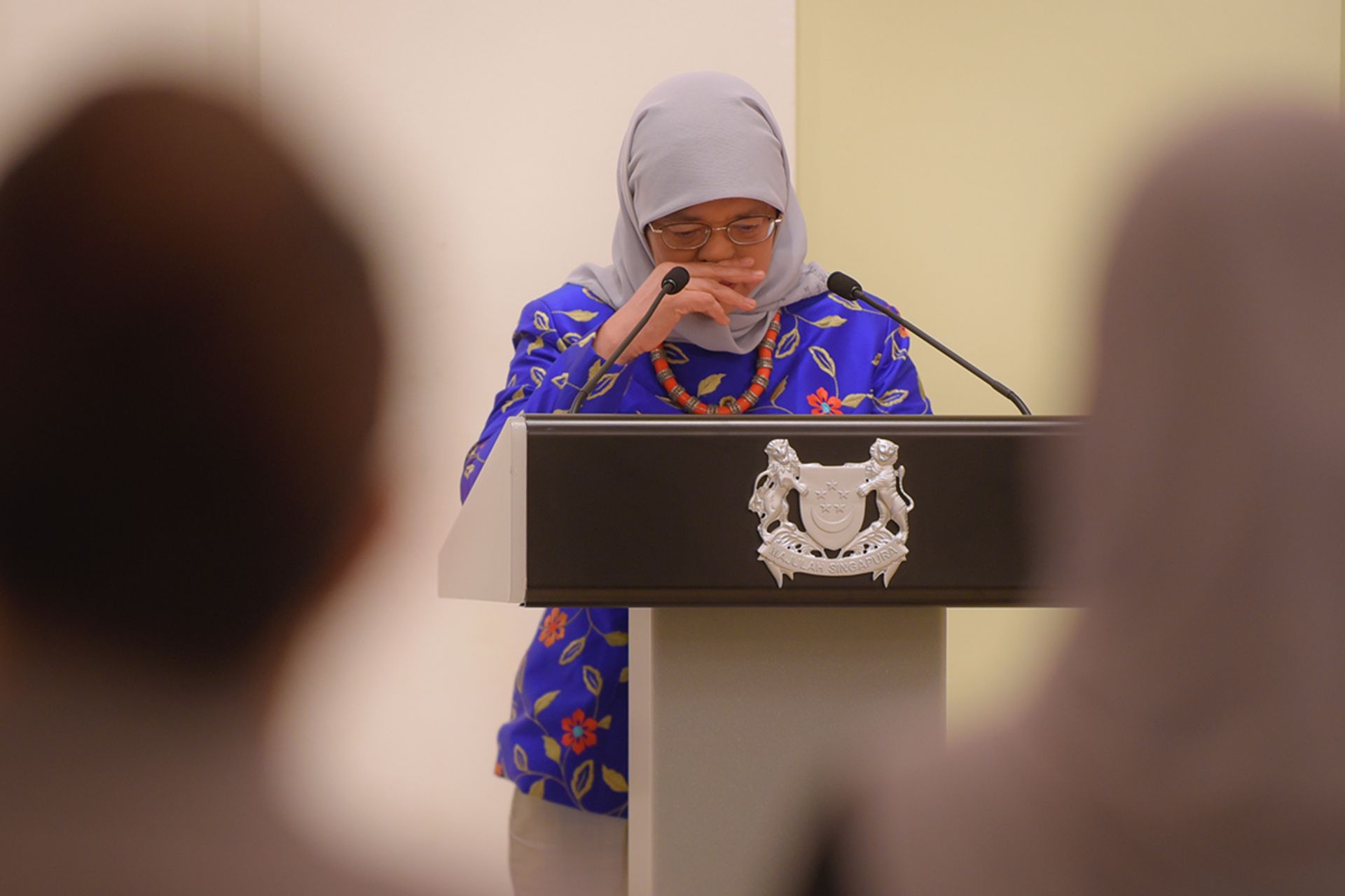 President Halimah tearing up as she speaks during the appreciation event for Covid-19 service workers as part of the third instalment of the #ServingSG series, at the Istana on Jan 27, 2022. ST PHOTO: MARK CHEONG