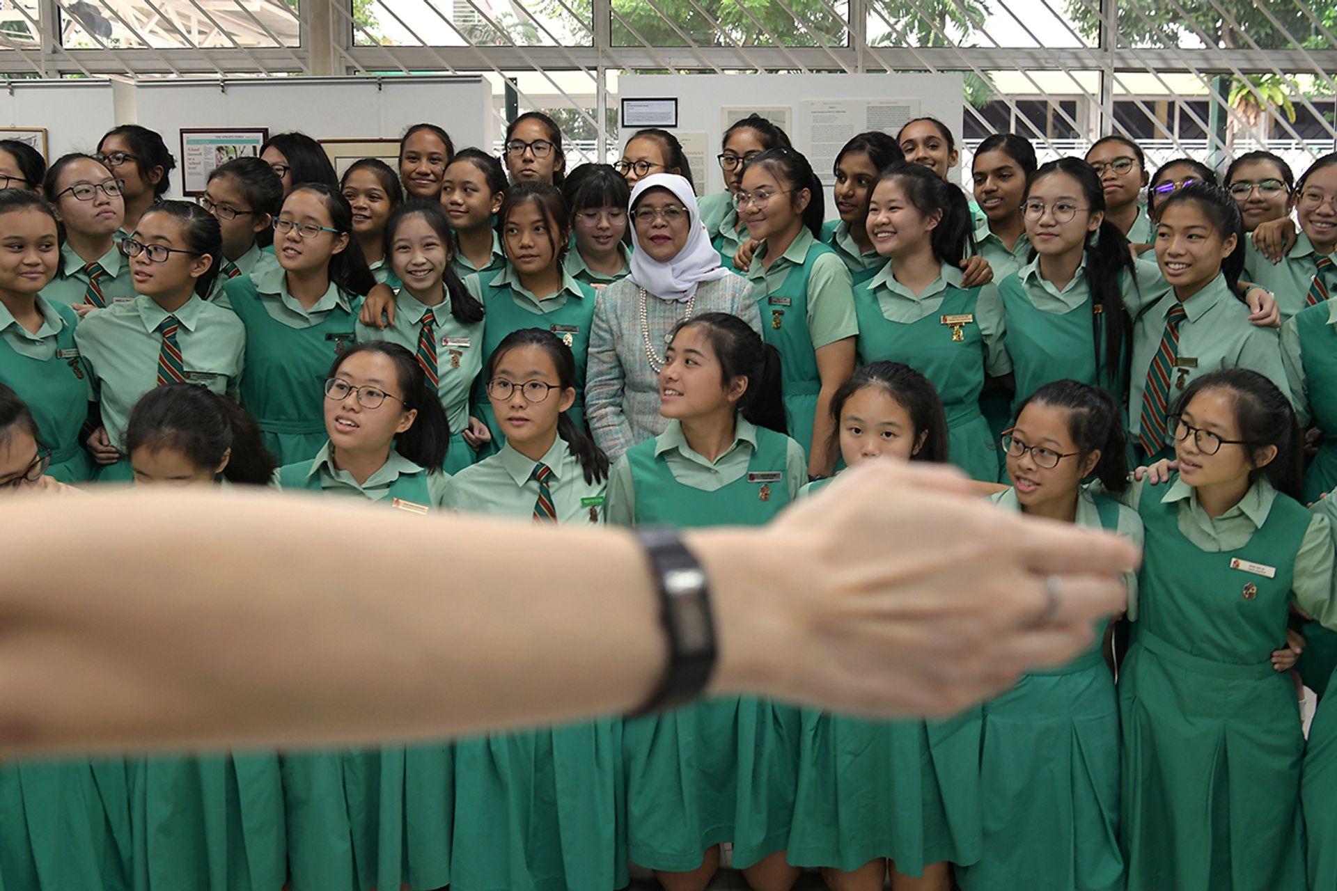 President Halimah in a photo shoot with students from her alma mater, Tanjong Katong Girls’ School, after a dialogue at the school on June 27, 2018. ST PHOTO: NG SOR LUAN