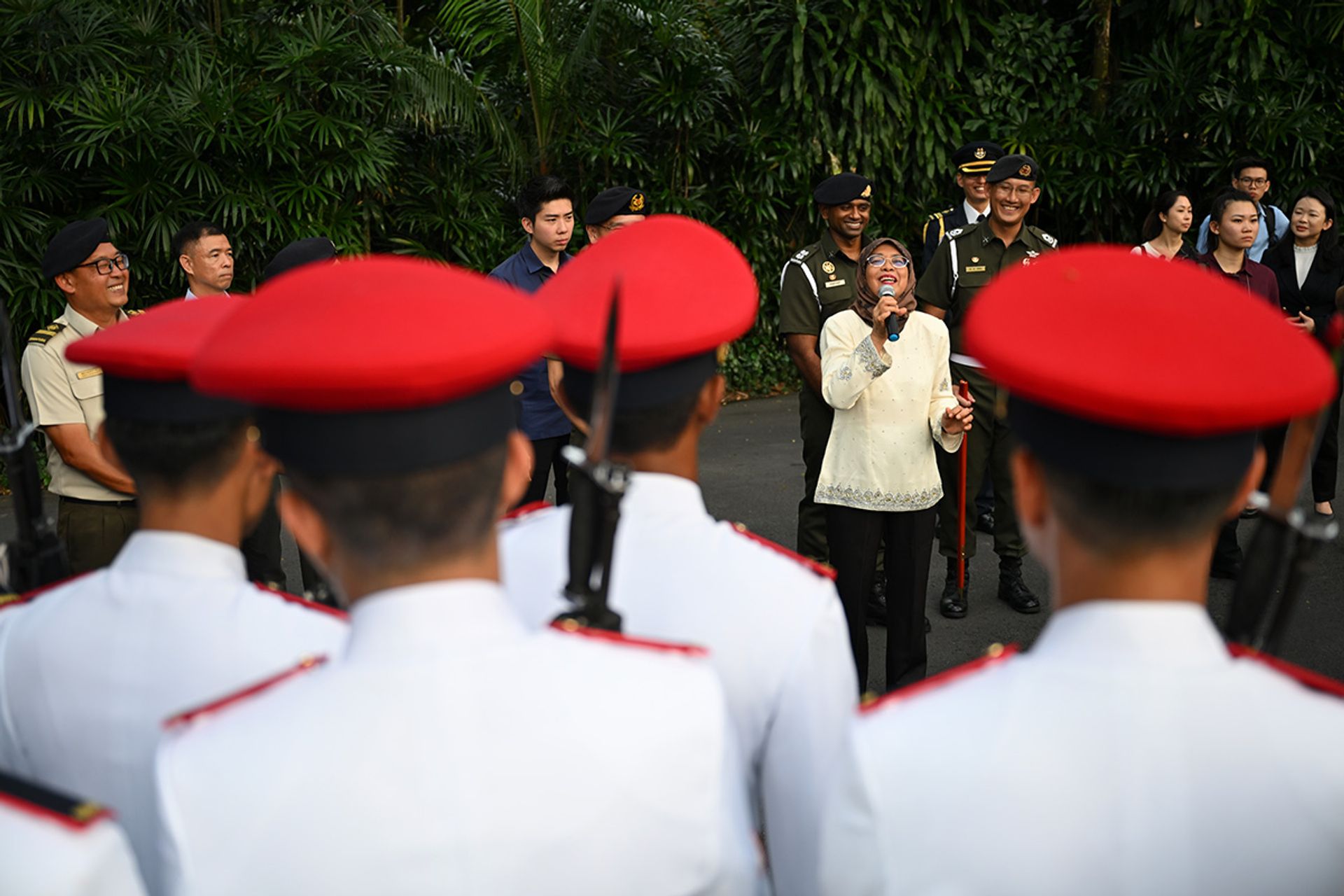 President Halimah attending the changing of guards ceremony at the Istana on Sept 3, 2023, to thank the Istana Ceremonial Guards for their service. ST PHOTO: SHINTARO TAY
